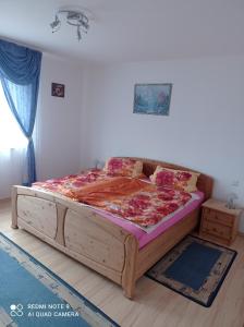 a bedroom with a wooden bed in a room at Ferienwohnung Idarblick in Idar-Oberstein
