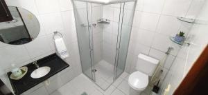a bathroom with a shower and a toilet and a sink at POUSADA VENTO NORTE CAMA & CAFÉ SUÍTES INDIVIDUAIs in João Pessoa +53 photos