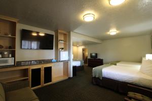 A kitchen or kitchenette at Dinosaur Inn & Suites