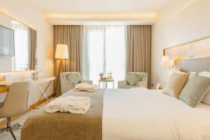 Кровать или кровати в номере Kahya Hotel Ankara