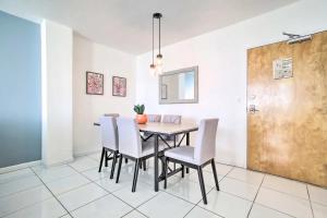 a dining room with a table and chairs at Ft Lauderdale Oceanfront Resort Condo with Views! apts in Fort Lauderdale