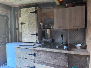 a kitchen with a sink and a counter top at Cabane 2 in Olivese