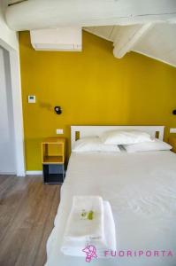 A bed or beds in a room at Corte 4 con parcheggio gratuito
