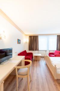 Postel nebo postele na pokoji v ubytování Hotel Eisensteiner Hof
