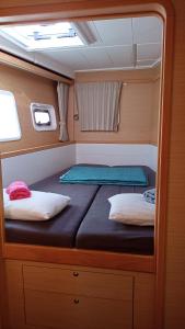 a small bed in the back of a boat at Croatia by Luxury Catamaran in Split