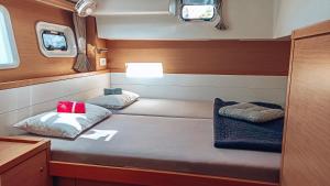 a small room with a bed in a boat at Croatia by Luxury Catamaran in Split