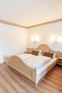 Postel nebo postele na pokoji v ubytování Hotel Eisensteiner Hof
