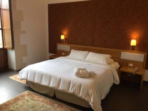 Postel nebo postele na pokoji v ubytování Grande Albergo Alfeo