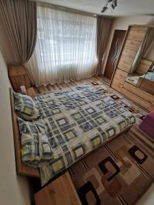an overhead view of a bed in a room at Katarina Central House Predeal in Predeal