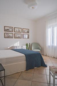 A bed or beds in a room at La Guardiola - Capo Perla