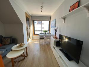 Et tv og/eller underholdning på Ático Rey Daviña Centro y Playa