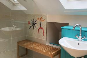 a bathroom with a sink and a toilet and a shower at Charming 1 bed loft in 16C house in city centre in Norwich