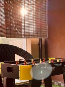 a table with toy figures on top of it at Wind and Wave Villa No 2, 2BHK Near Pondy Auroville Pondicherry in Marakkānam