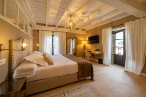 Posteľ alebo postele v izbe v ubytovaní Hotel Palacio De Luko