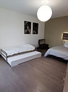Posteľ alebo postele v izbe v ubytovaní Gite de la Renne