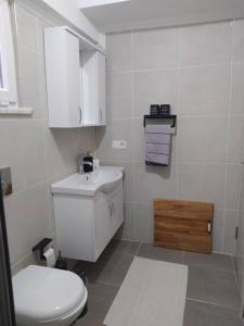 a white bathroom with a toilet and a sink at İstanbulda merkezi konum, müstakil bina in Istanbul +53 photos