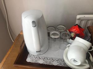 a white mixer sitting on top of a table at Southcote Accommodation in Tintagel