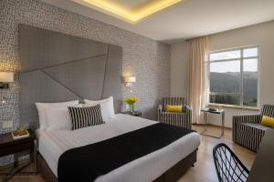 Letto o letti in una camera di Hotel Yehuda