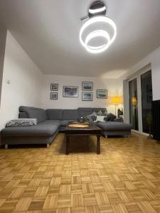 a living room with a couch and a coffee table at Apartament Rumia 45 in Rumia