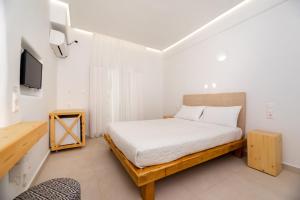 Ένα ή περισσότερα κρεβάτια σε δωμάτιο στο Hotel Thira