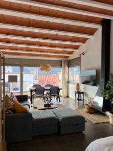a living room with a couch and a table at Big family house in the Center of el port de la selva in Port de la Selva