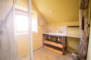 a bathroom with a sink and a shower at Le chant des pierres - douceur et nature in Les Marthres +9 photos
