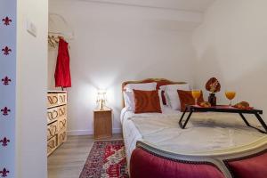 a bedroom with a bed with a table on it at L'appart chez Remy in Dijon