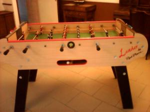 a large wooden pool table with balls on it at le logis gourmand a Payroux in Payroux