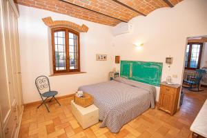 Postel nebo postele na pokoji v ubytování Affitti Brevi Toscana - Ospitalità in Campagna