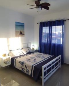 Postel nebo postele na pokoji v ubytování Tropical Blue apartments