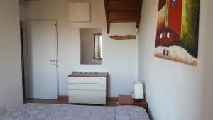 A bed or beds in a room at Casa Sant'Anna