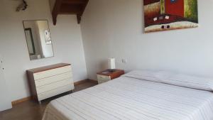 A bed or beds in a room at Casa Sant'Anna