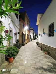 an alley in an old town at night at Goliva las Rosas in Barbate