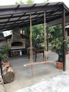 a picnic shelter with a table and a stone oven at Rest house Jermuk in Jermuk