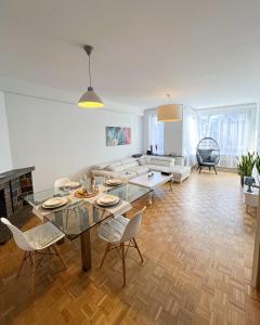 a living room with a table and chairs and a couch at Cosy two bedroom apartment in Brussels in Brussels