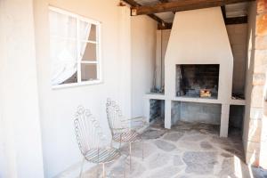 Μια τηλεόραση ή/και κέντρο ψυχαγωγίας στο Willemsrivier Trekpad Guest Houses