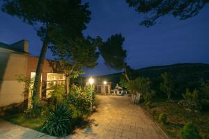 a house with a lighted driveway at night at LA GEVELA in Albalate de Zorita
