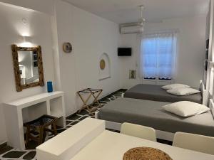 Posteľ alebo postele v izbe v ubytovaní Angie's Studios