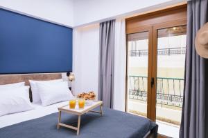 Posteľ alebo postele v izbe v ubytovaní Alcyone Studios and Apartments