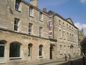 an old stone building on the side of a street at Cotswolds Lake side home with luxury spa Swallows Nest,Lower Mill Estate, Lakeside home/spa in Somerford Keynes