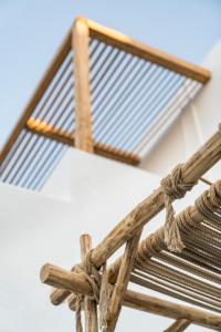 a close up of a wooden bench with a grate at Sandaya Luxury Suites in Naousa