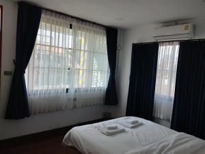 Postel nebo postele na pokoji v ubytování TarTar & Nay Hostel