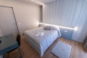 Tempat tidur dalam kamar di Dalmazia Boutique Apartment