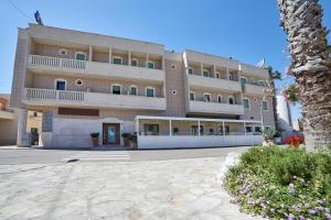 a large building with a lot of windows at Hotel dei Messapi in Muro Leccese