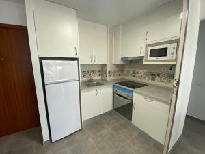 Kuchyň nebo kuchyňský kout v ubytování Apartamentos CH 2