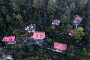 an aerial view of a house with a pink roof at The Canadian Woods Resort in Nainital