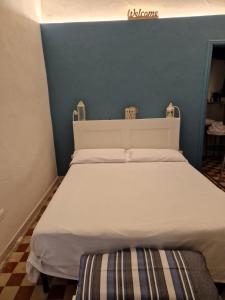 Postel nebo postele na pokoji v ubytování B&B Porto Trani