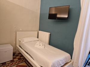 Postel nebo postele na pokoji v ubytování B&B Porto Trani