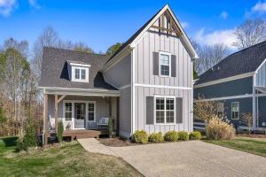 a house with a white and gray house at Beautiful Home with Lake and Marina Access, Firepit, Golf Cart Included in Estill Springs