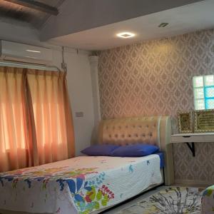 a small bedroom with a bed in a room at Challet Baitul Hanan with Private Pool near KLIA in Sepang